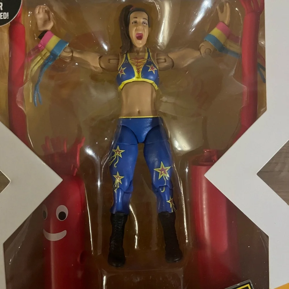 WWE Bayley‎ Elite Figure with Blue and Yellow Attire